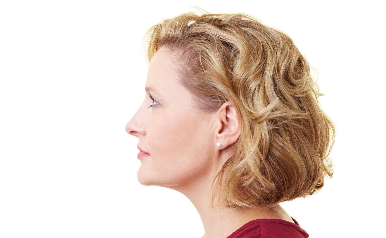 Profile view of a woman looking rightward; Shutterstock ID 44233117