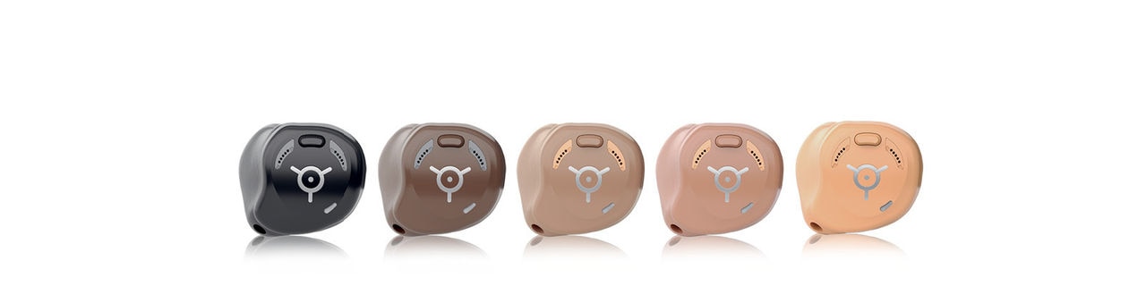 Rechargeable In-the-ear hearing aids lined up in 5 colors
