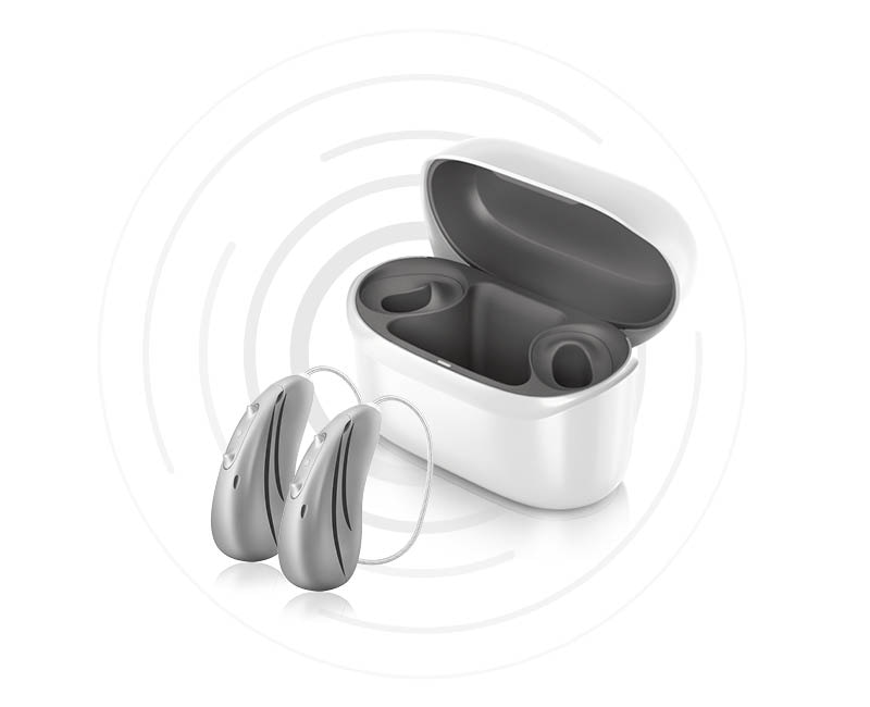 Pair of Hansaton sound E-R hearing aids and charger  