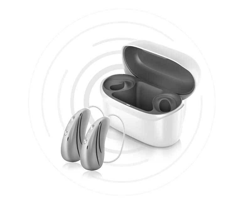 Pair of Hansaton sound E-R hearing aids and charger  