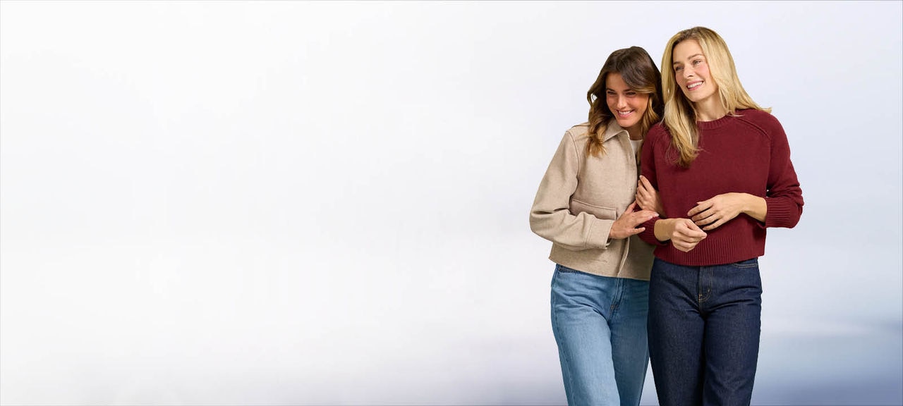 Two woman talking together and walking