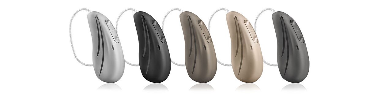 Hearing aids in five tone-in-tone colors: Sterling Silver, Metallic Anthracite, Carbon Black, Mocha Brown, and Cashmere Beige